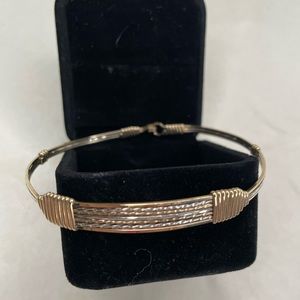 Gold wire Ronald’s bracelet.